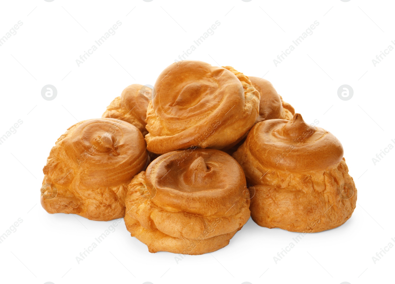 Photo of Pile of delicious profiteroles on white background