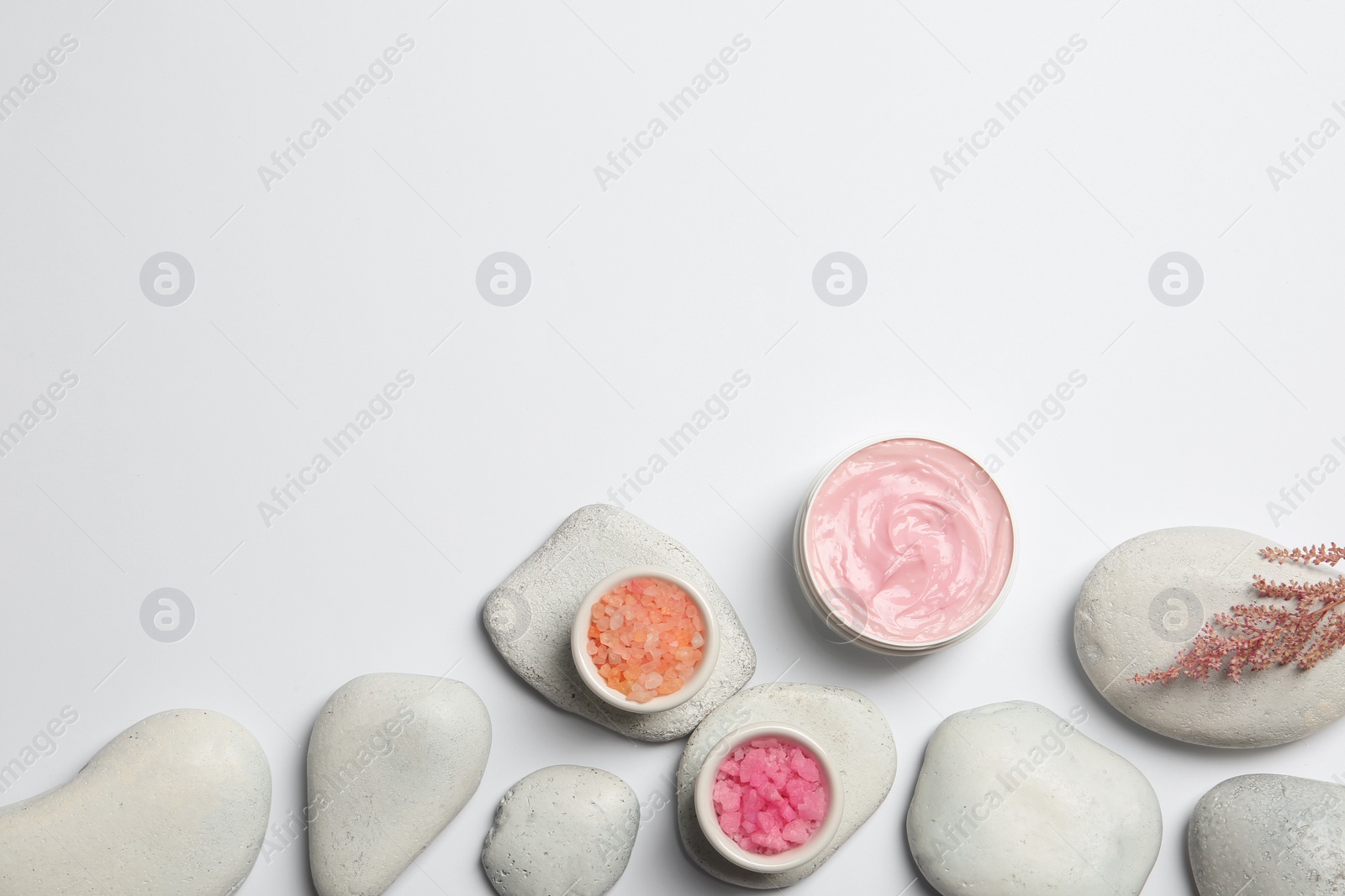 Photo of Flat lay composition with spa stones and space for text on white background