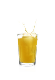 Juice splashing out of glass isolated on white