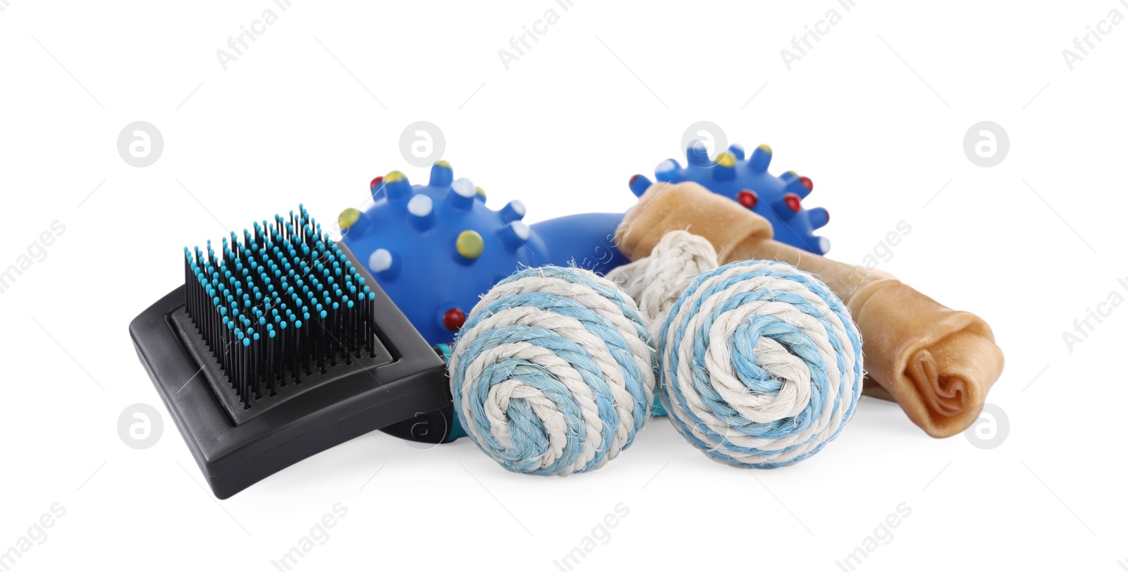 Photo of Pet toys, brush and dog treat isolated on white