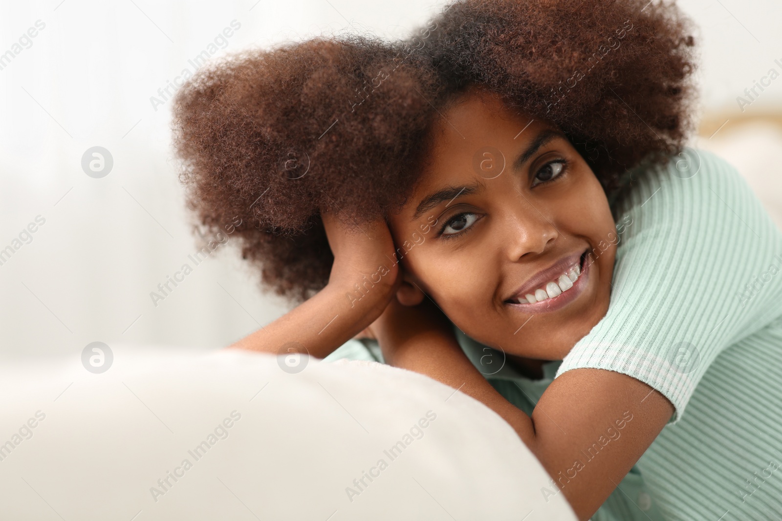 Photo of Portrait of smiling African American woman at home