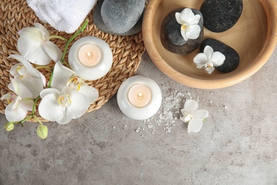 Photo of Flat lay composition with spa stones and candles on gray table