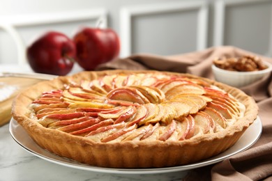 Delicious homemade apple tart on white table