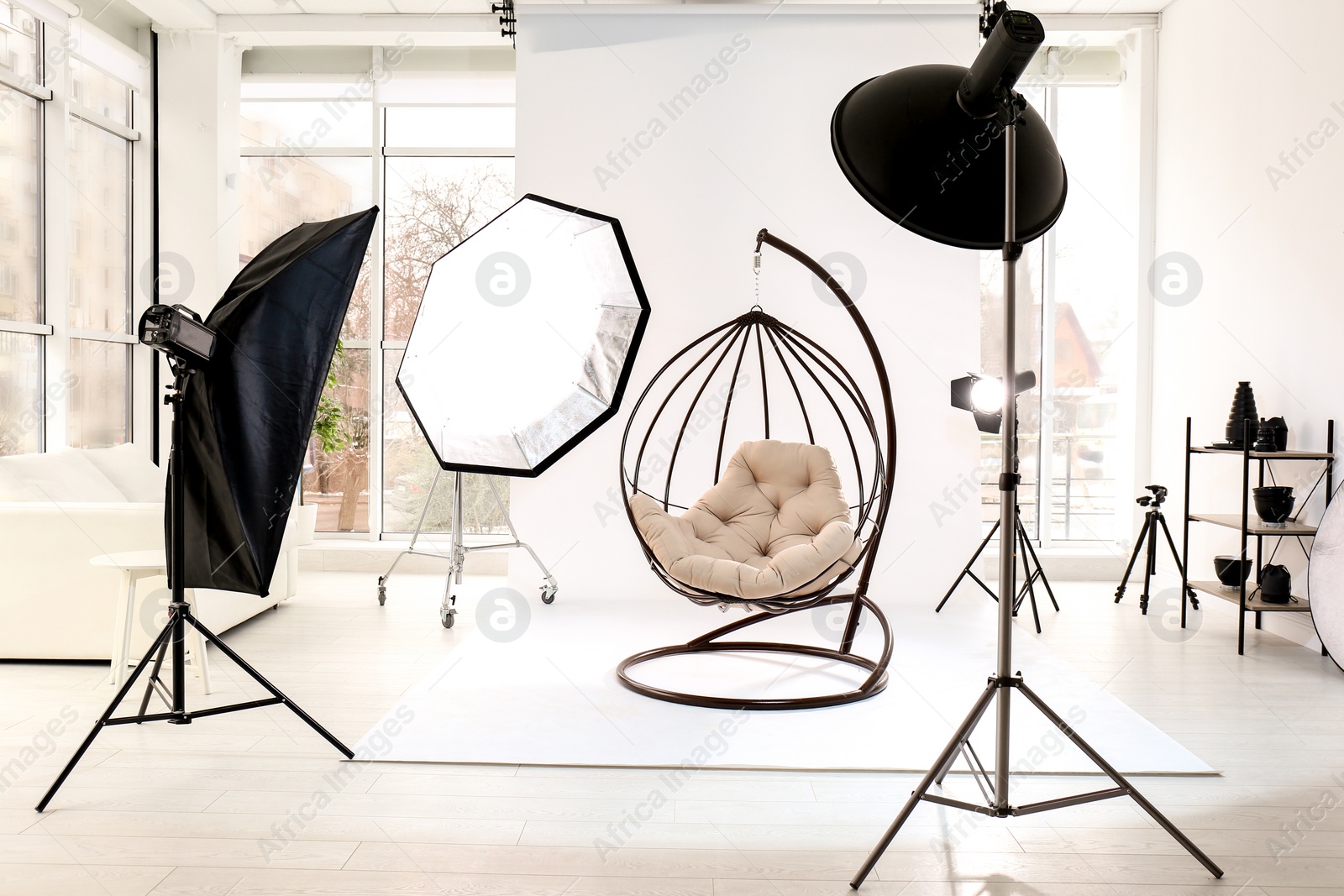 Photo of Hanging chair in photo studio with professional equipment