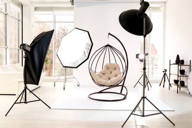 Photo of Hanging chair in photo studio with professional equipment