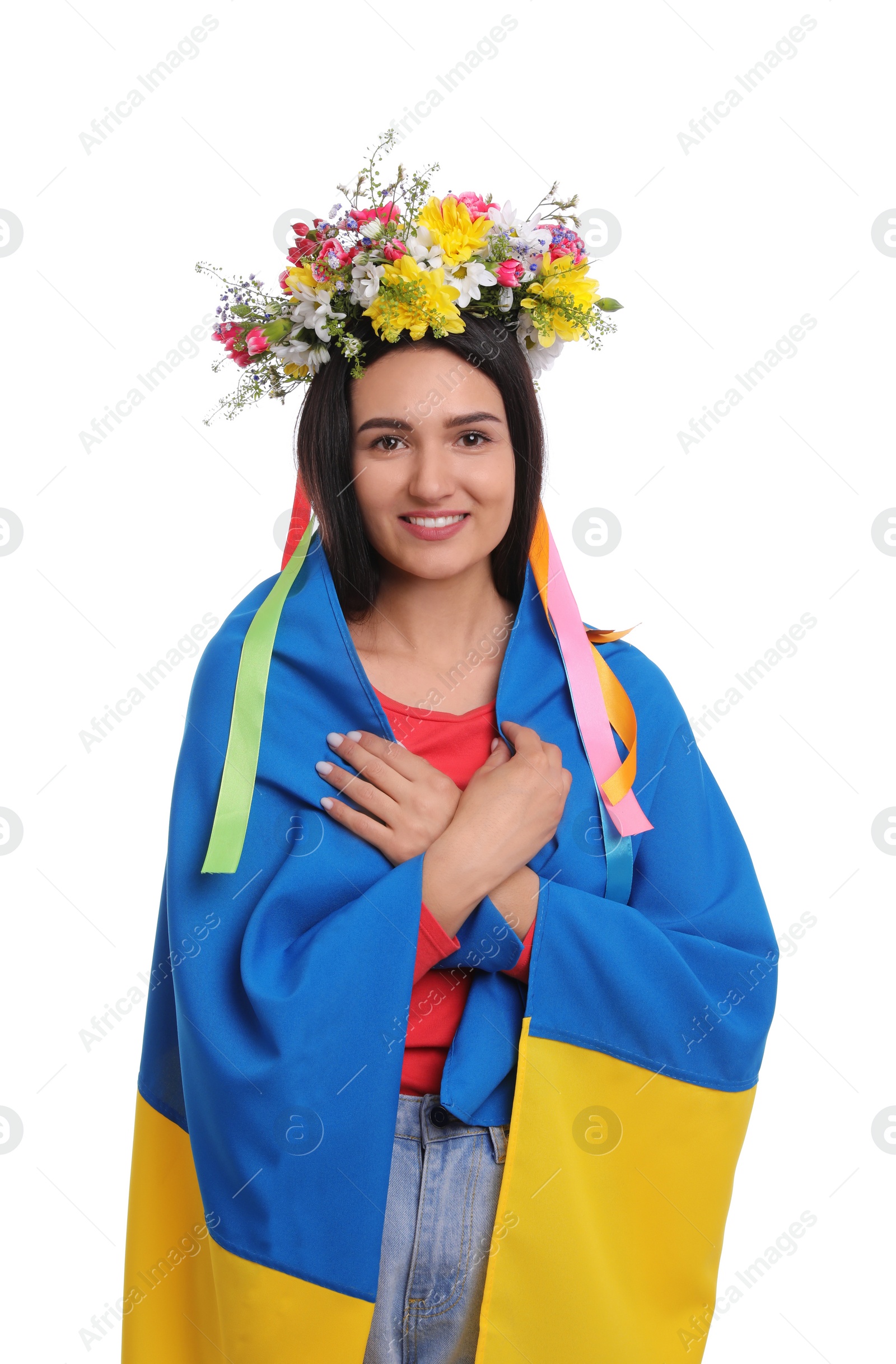 Photo of Young woman in flower wreath with flag of Ukraine on white background