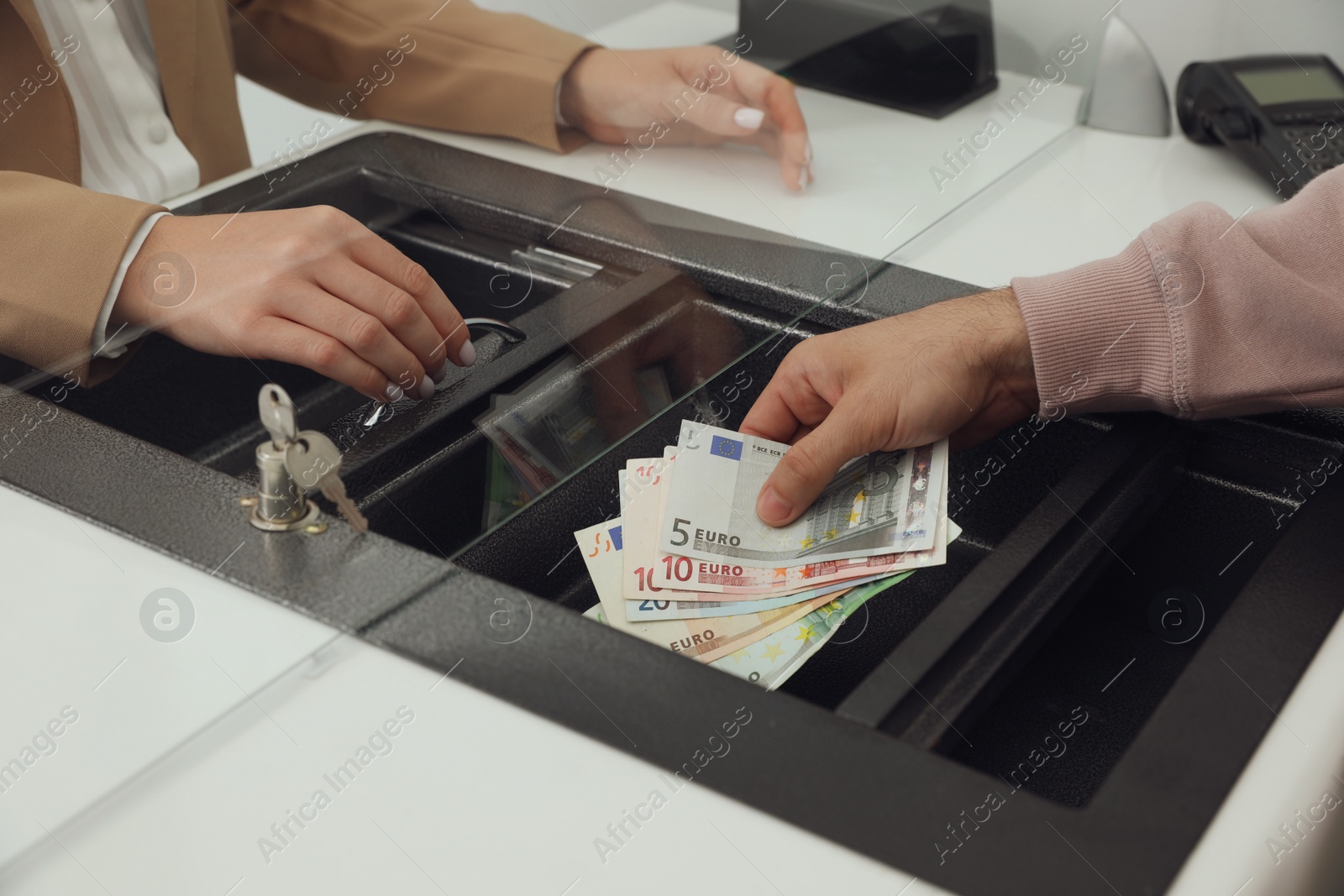 Photo of Man giving money to cashier in bank, closeup. Currency exchange