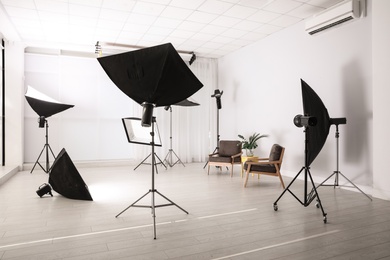 Photo of Professional photo studio equipment prepared for shooting interior