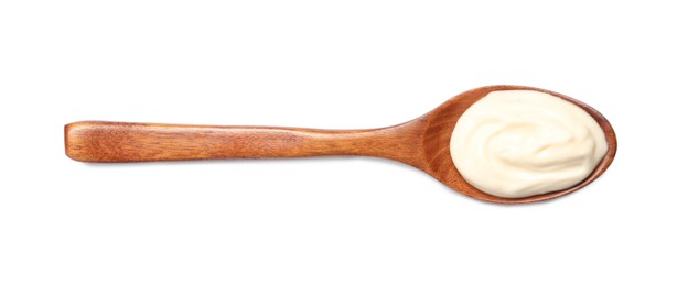 Photo of Wooden spoon with mayonnaise isolated on white, top view