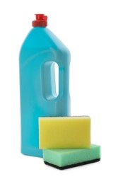 Bottle of detergent and cleaning sponges on white background