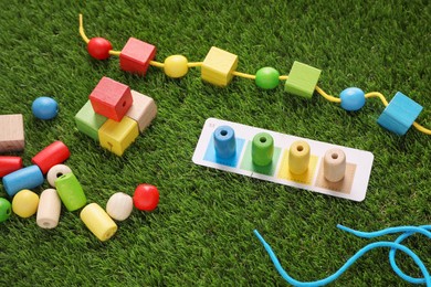 Photo of Educational toy for motor skills development on artificial grass