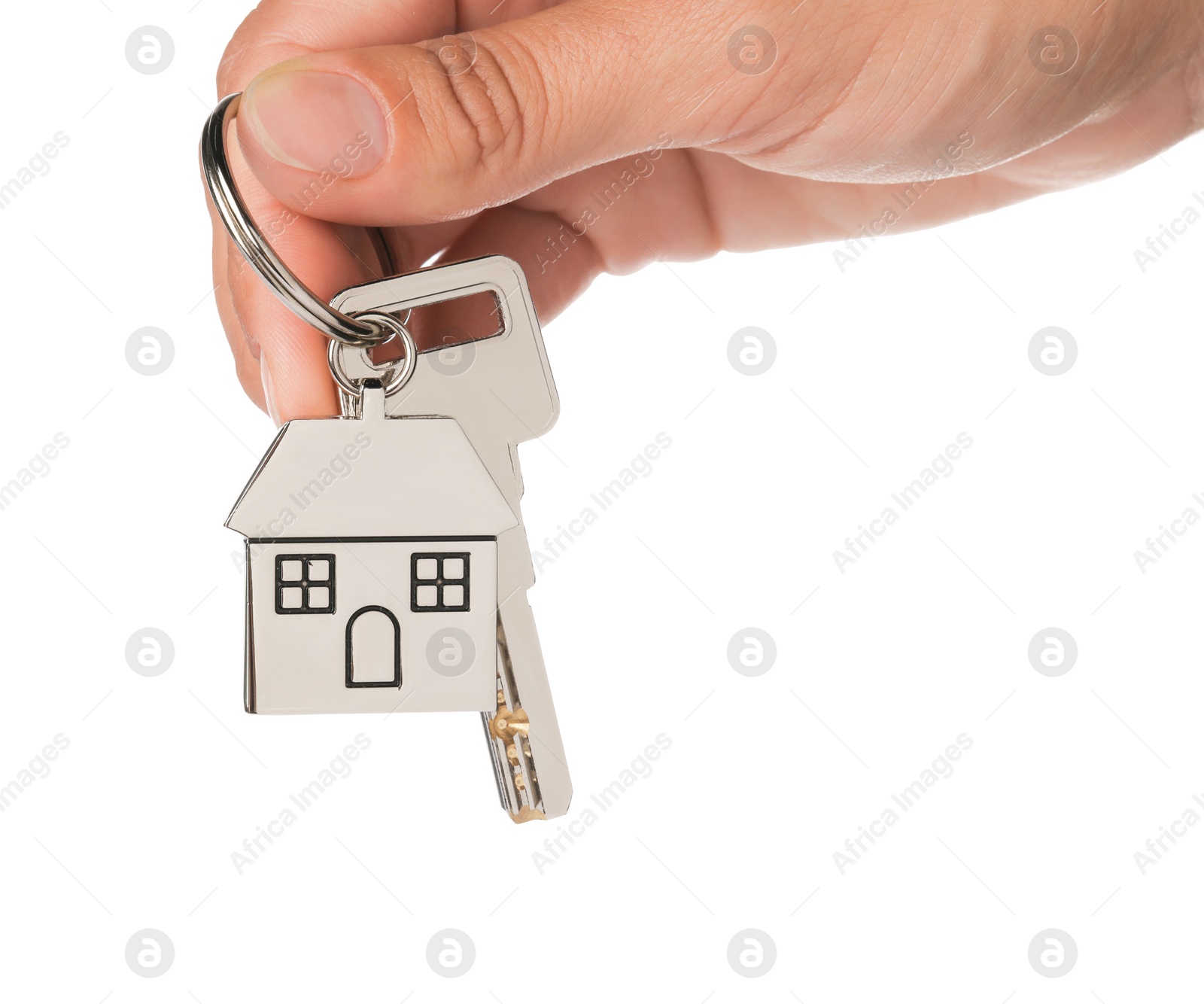 Photo of Woman holding key with metallic keychain in shape of house on white background, closeup