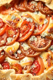 Photo of Tasty galette with tomato and cheese (Caprese galette) as background, top view