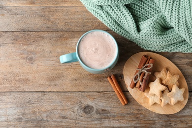 Photo of Composition with delicious hot cocoa drink and cookies on wooden background, flat lay