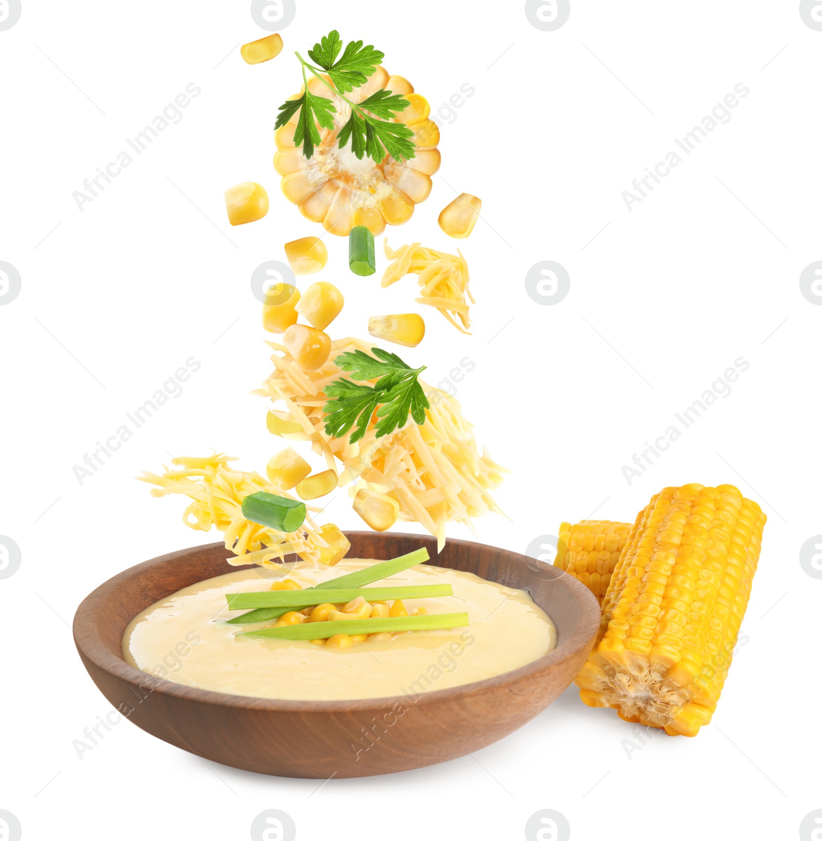 Image of Collage with ingredients falling into bowl of corn soup on white background 