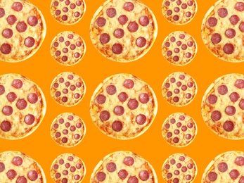 Image of Pepperoni pizza pattern design on orange background 