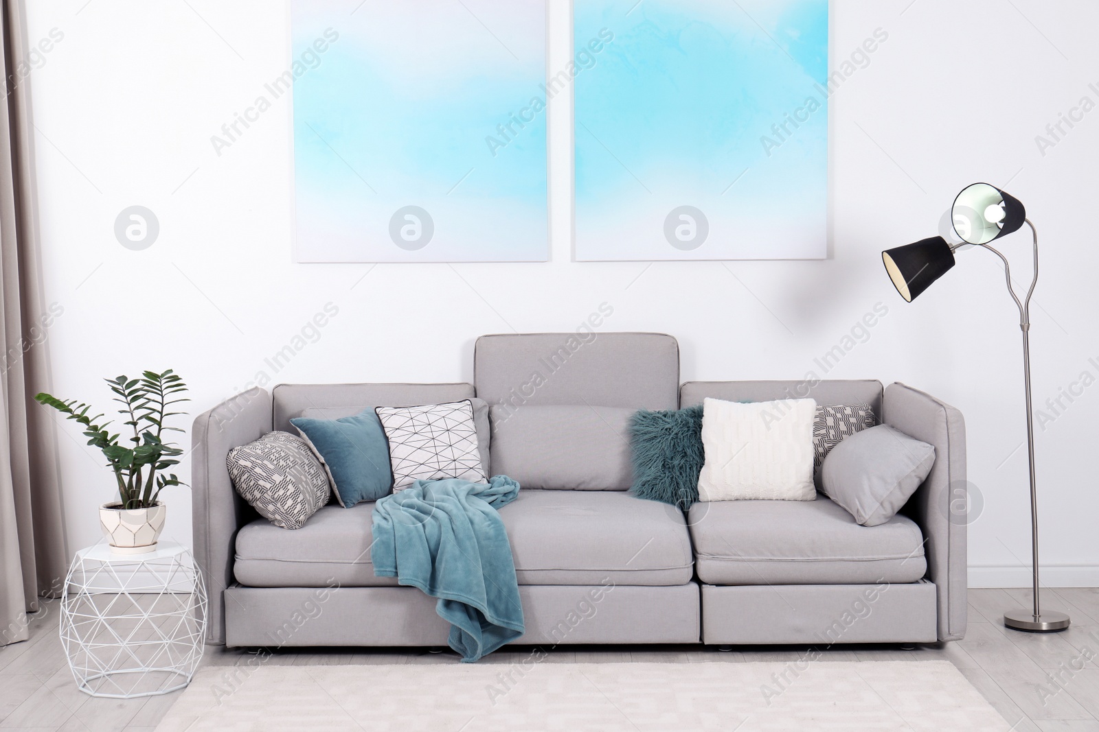 Photo of Stylish living room interior with comfortable sofa