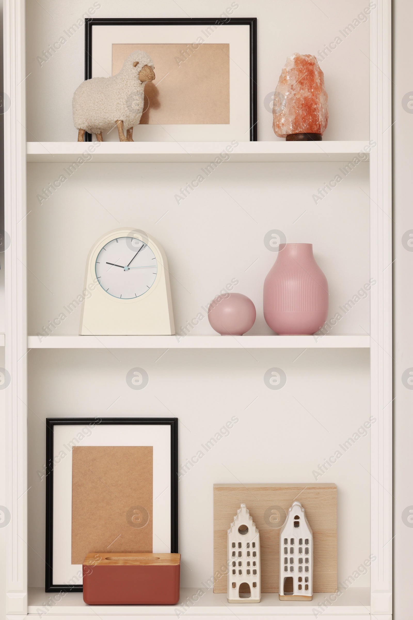 Photo of Shelves with different decor indoors. Interior design