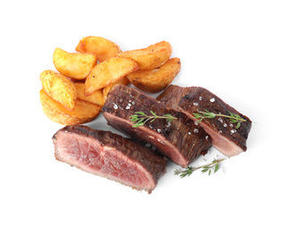 Delicious sliced beef steak with fried potatoes isolated on white