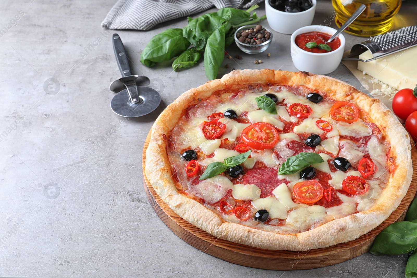 Photo of Hot delicious pizza Diablo on grey table