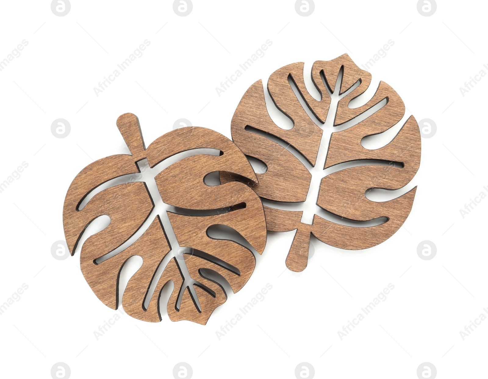 Photo of Leaf shaped wooden cup coasters on white background, top view