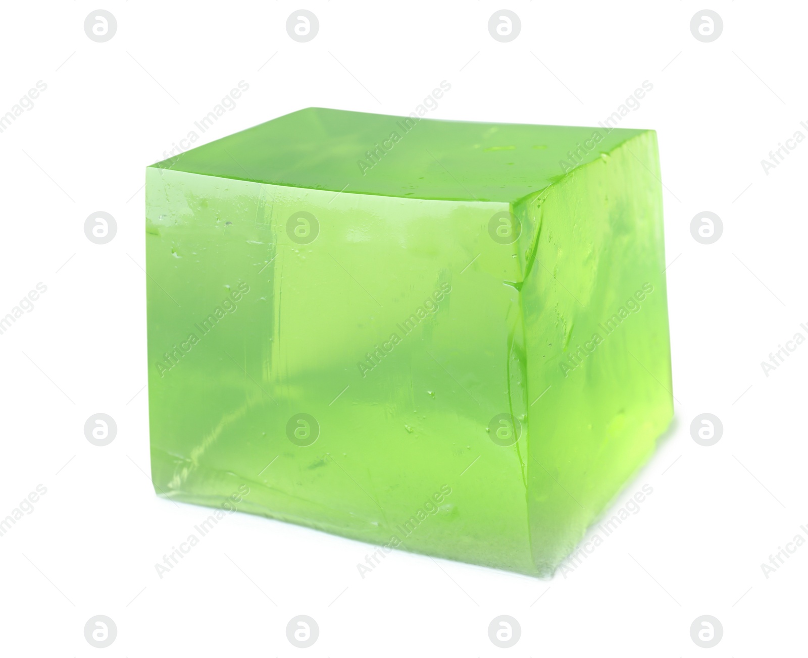 Photo of Delicious green jelly cube on white background