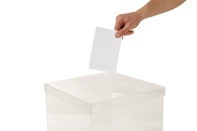 Man putting his vote into ballot box on white background, closeup