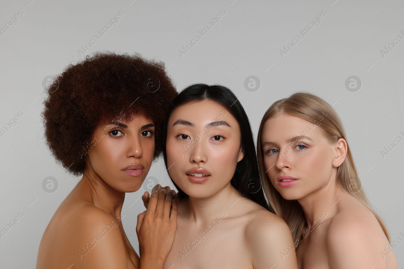 Photo of Portrait of beautiful young women on light grey background