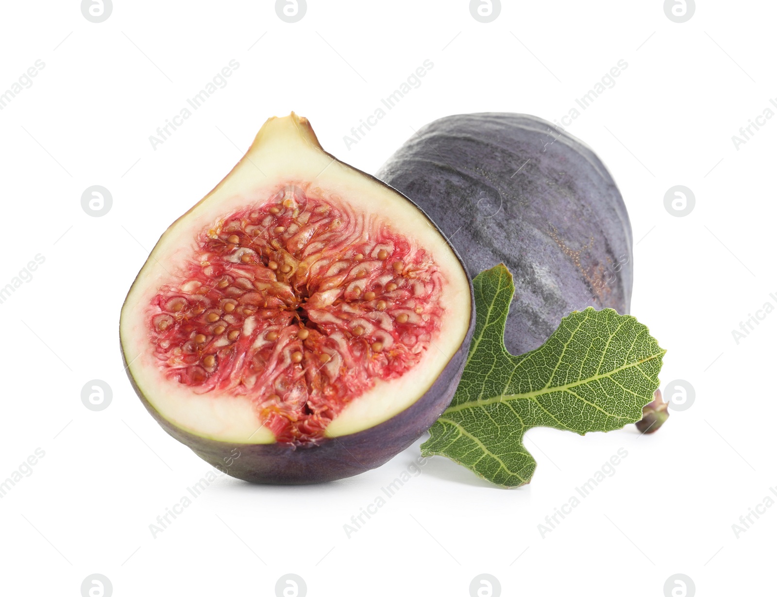 Photo of Whole and cut purple figs on white background