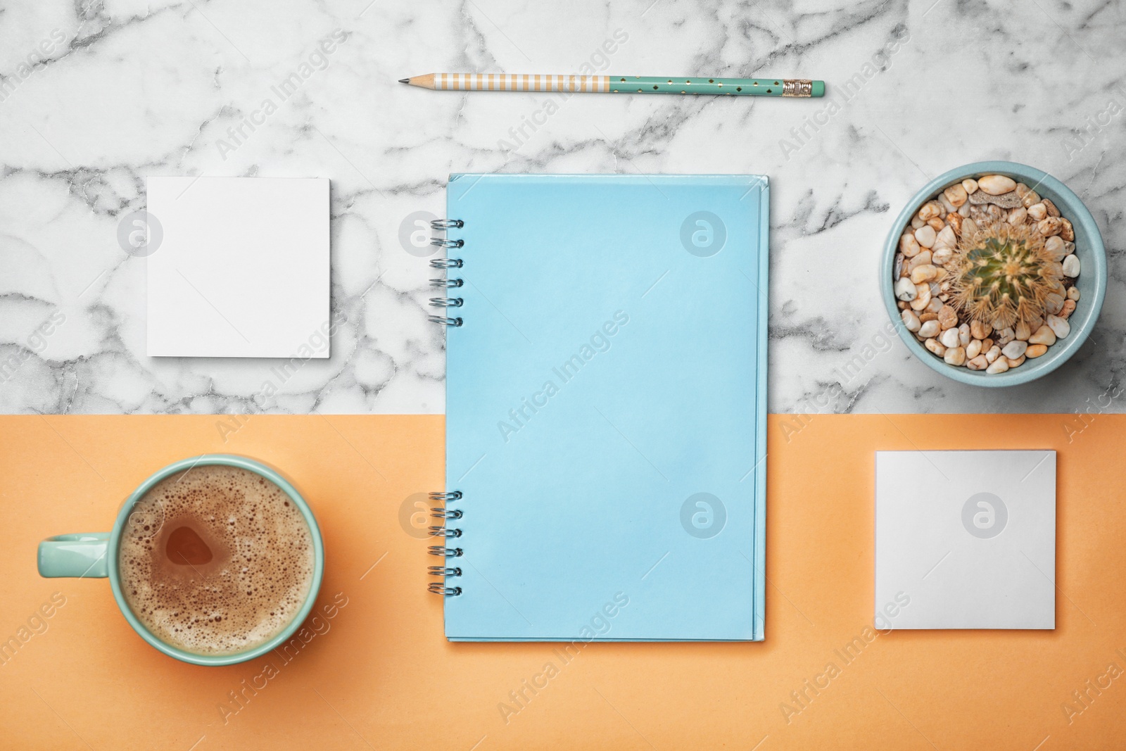 Photo of Flat lay composition with notebook and cup of aromatic coffee on color background