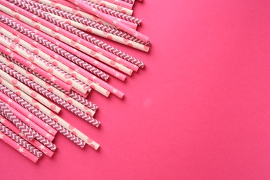 Photo of Many paper drinking straws on pink background, flat lay. Space for text