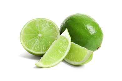 Fresh ripe green limes on white background