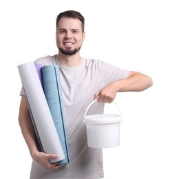 Photo of Man with wallpaper rolls and bucket of glue on white background