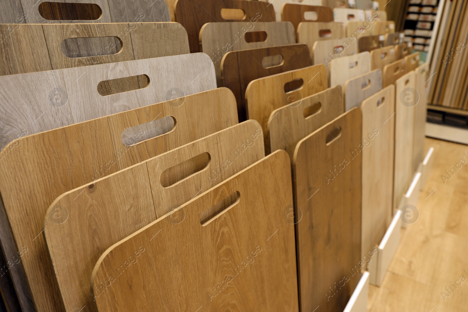 Photo of Many different samples of wooden flooring in store