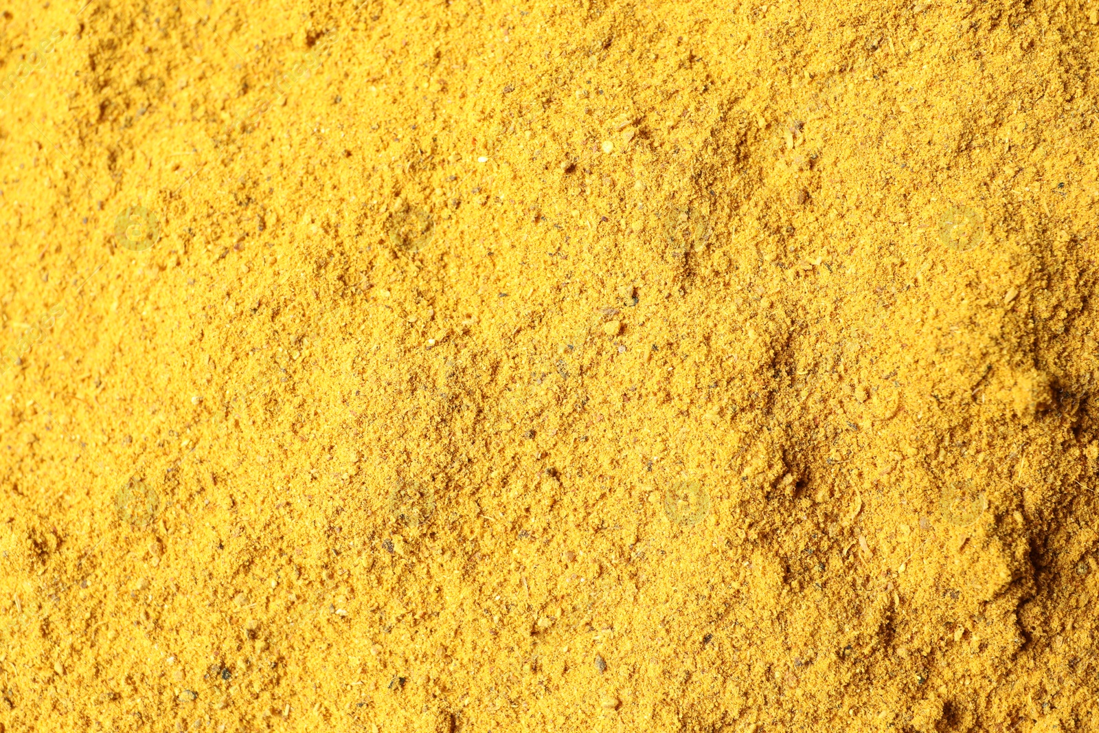 Photo of Dry curry powder as background, top view