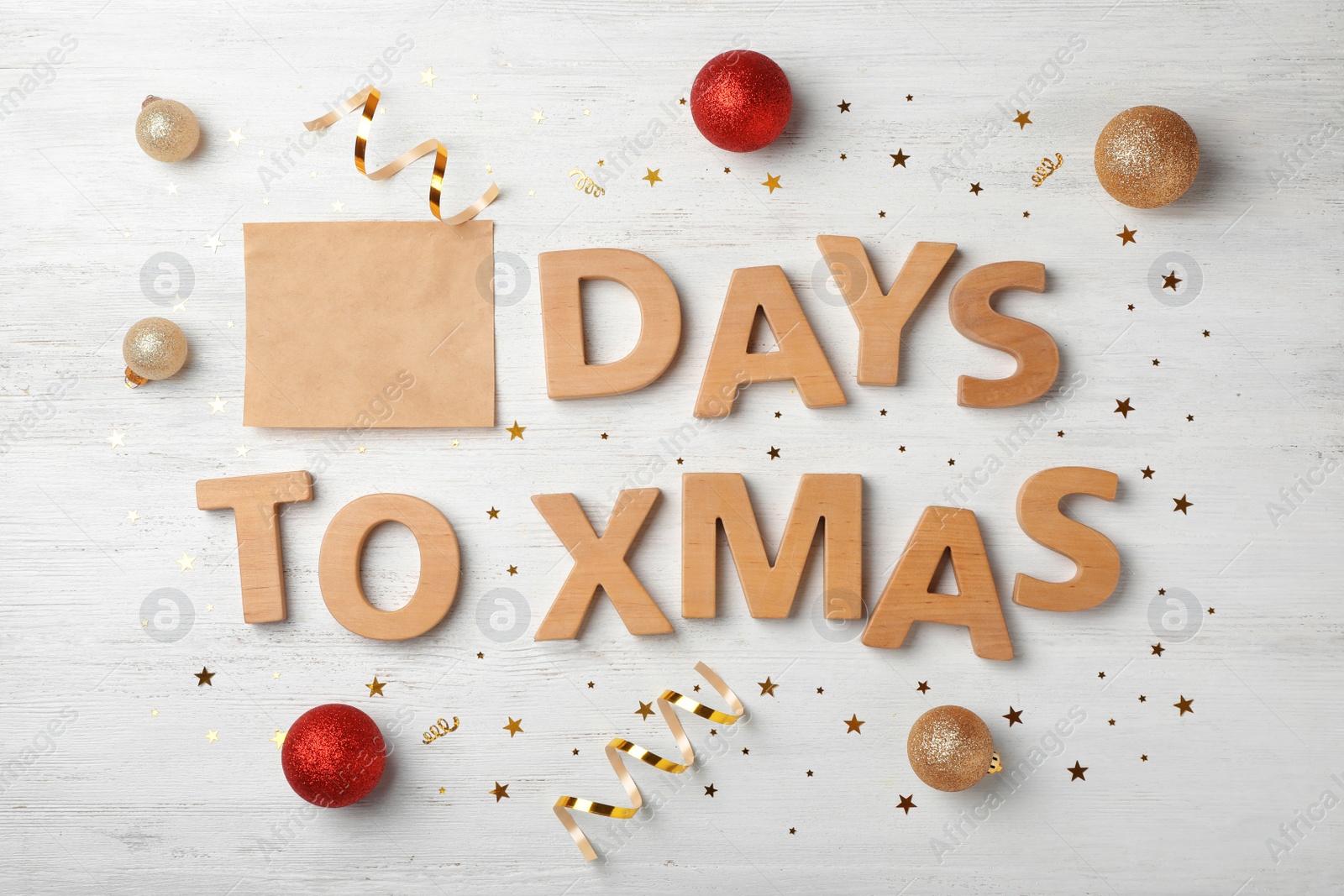 Photo of Flat lay composition with words DAYS TO XMAS and holiday decor on wooden background. Christmas countdown