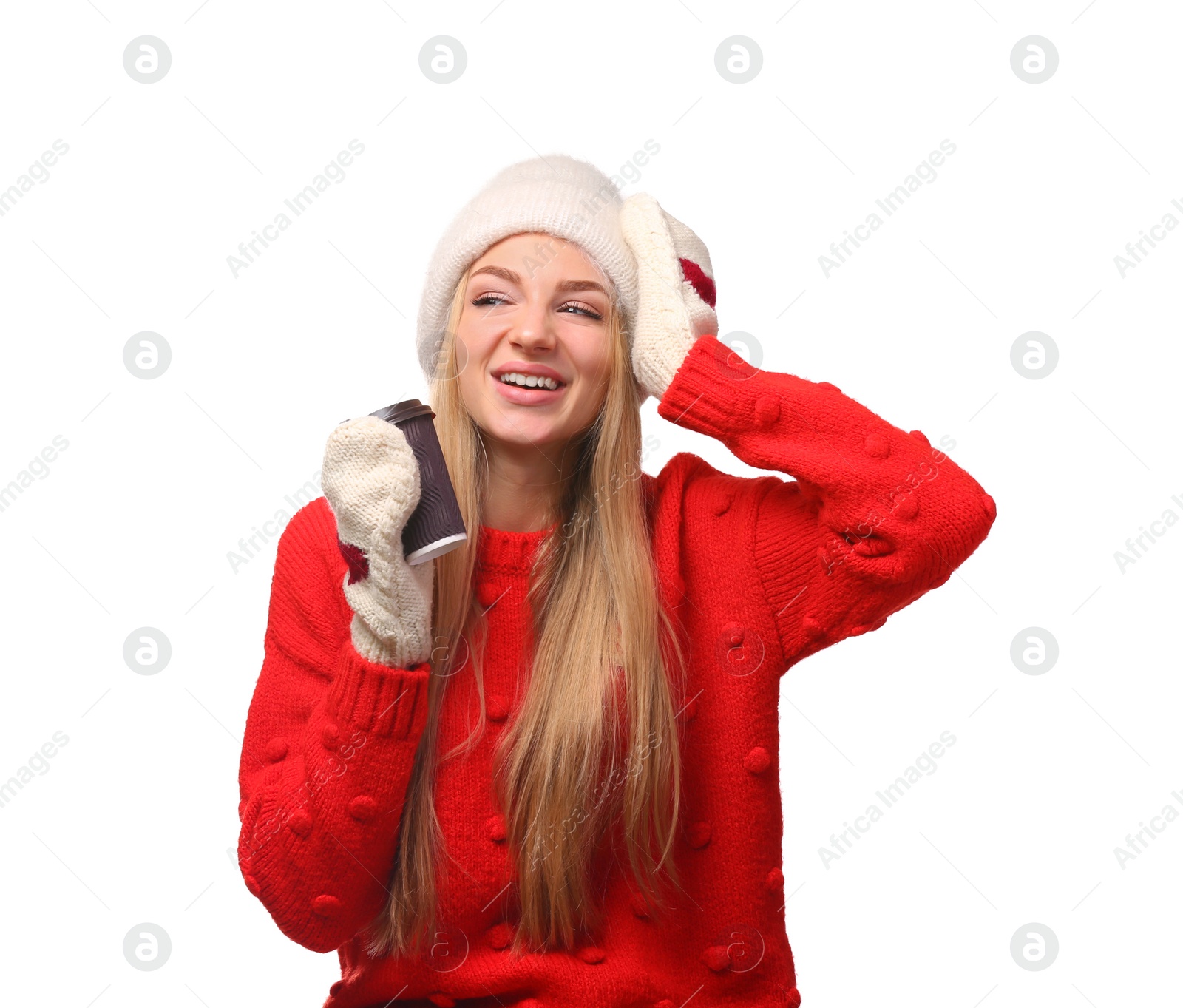 Photo of Portrait of young woman in stylish hat and sweater with paper coffee cup on white background. Winter atmosphere