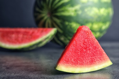 Photo of Fresh juicy slice of watermelon on table