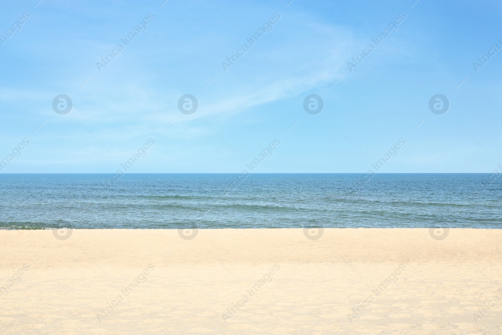 Photo of Picturesque view of sandy beach near sea