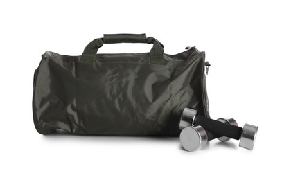 Photo of Sports bag and dumbbells on white background