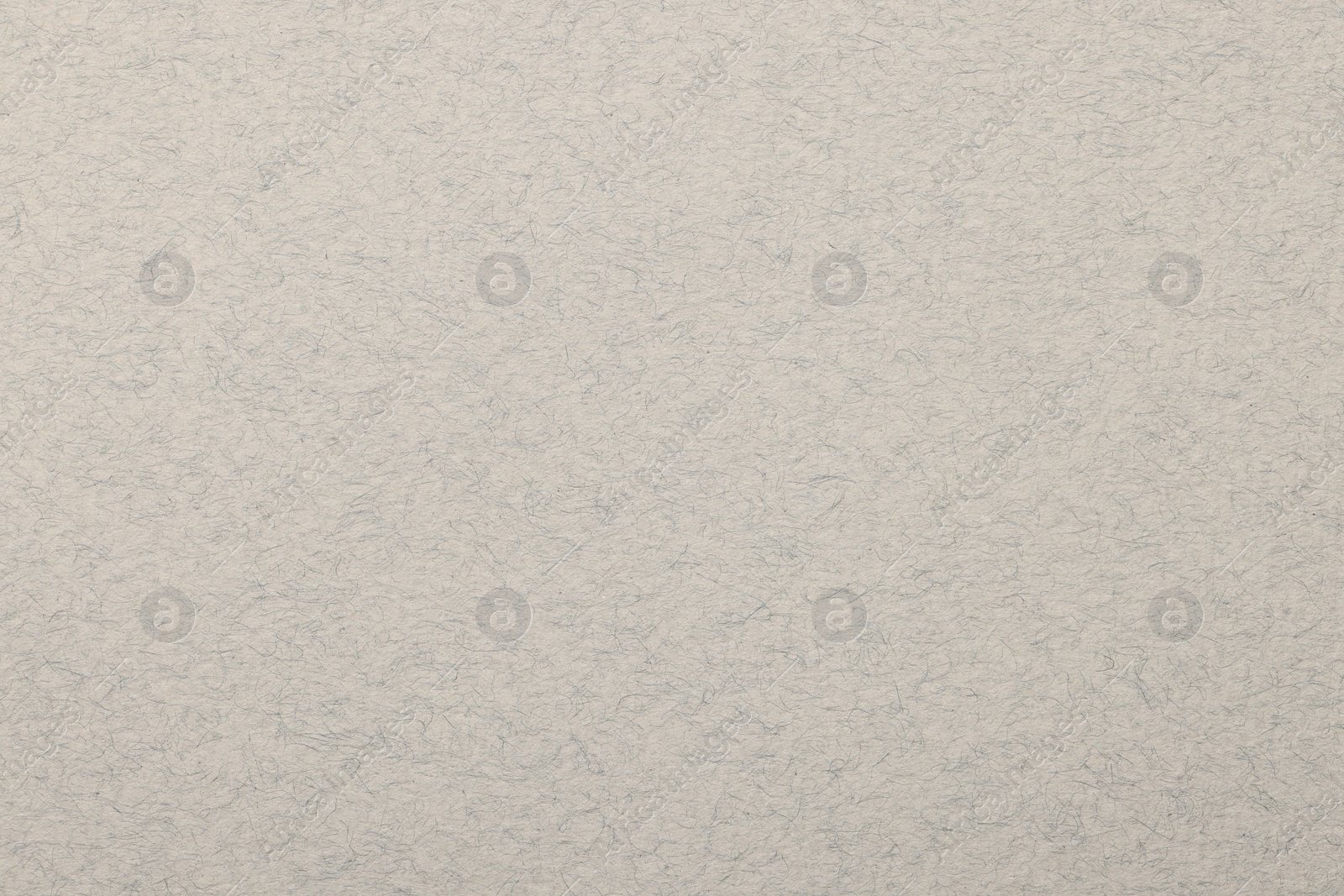 Photo of Texture of light grey paper sheet as background, top view