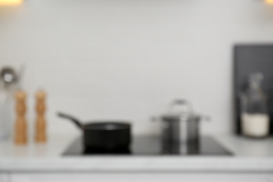 Photo of Blurred view of modern kitchen with stove