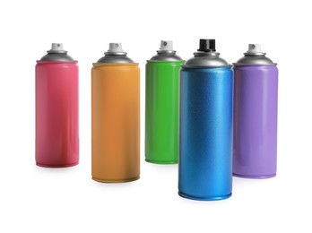 Photo of Cans of different spray paints on white background. Graffiti supplies