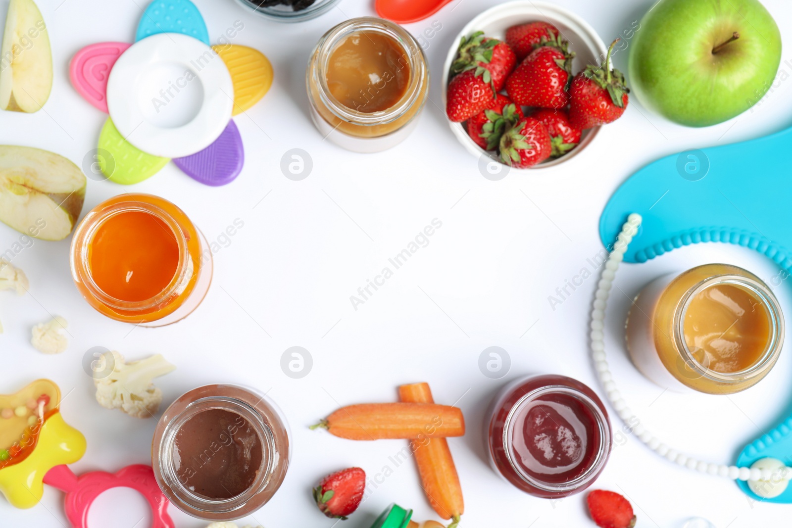 Photo of Frame of baby food, ingredients and accessories on white background, flat lay. Space for text