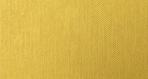 Texture of yellow fabric as background, top view