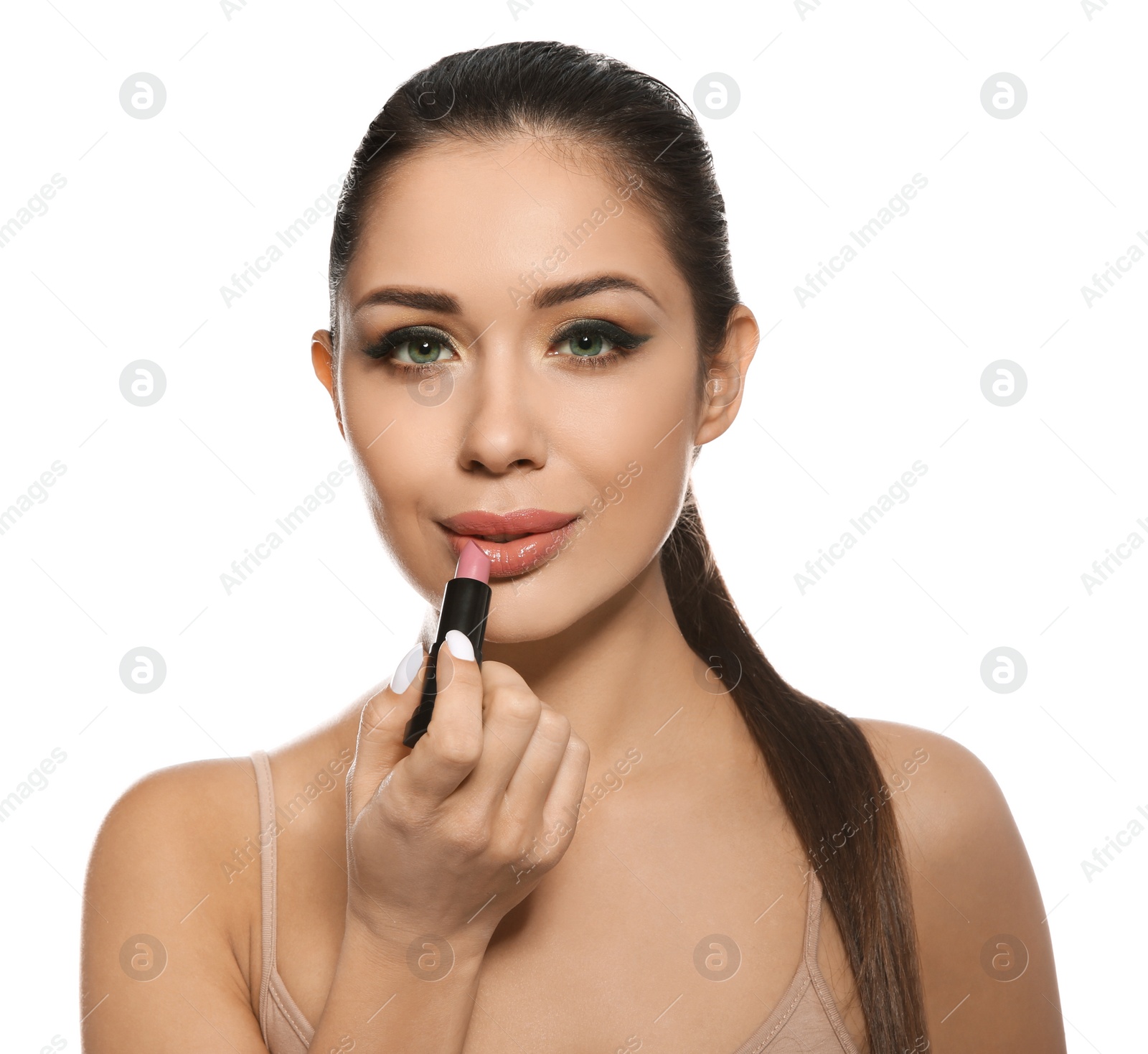 Photo of Beautiful woman applying lipstick on white background. Stylish makeup