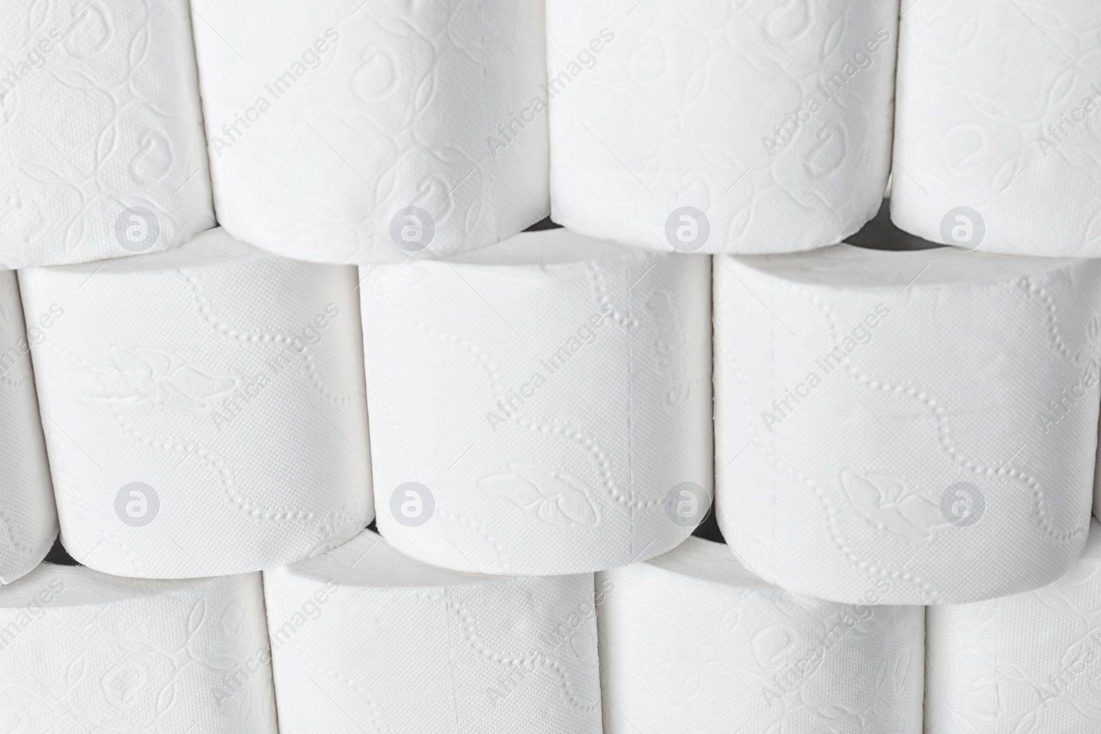 Photo of Many rolls of toilet paper as background. Personal hygiene