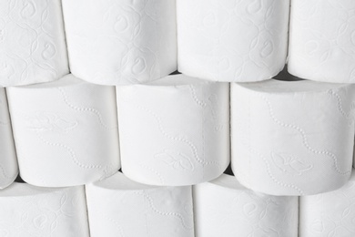 Photo of Many rolls of toilet paper as background. Personal hygiene