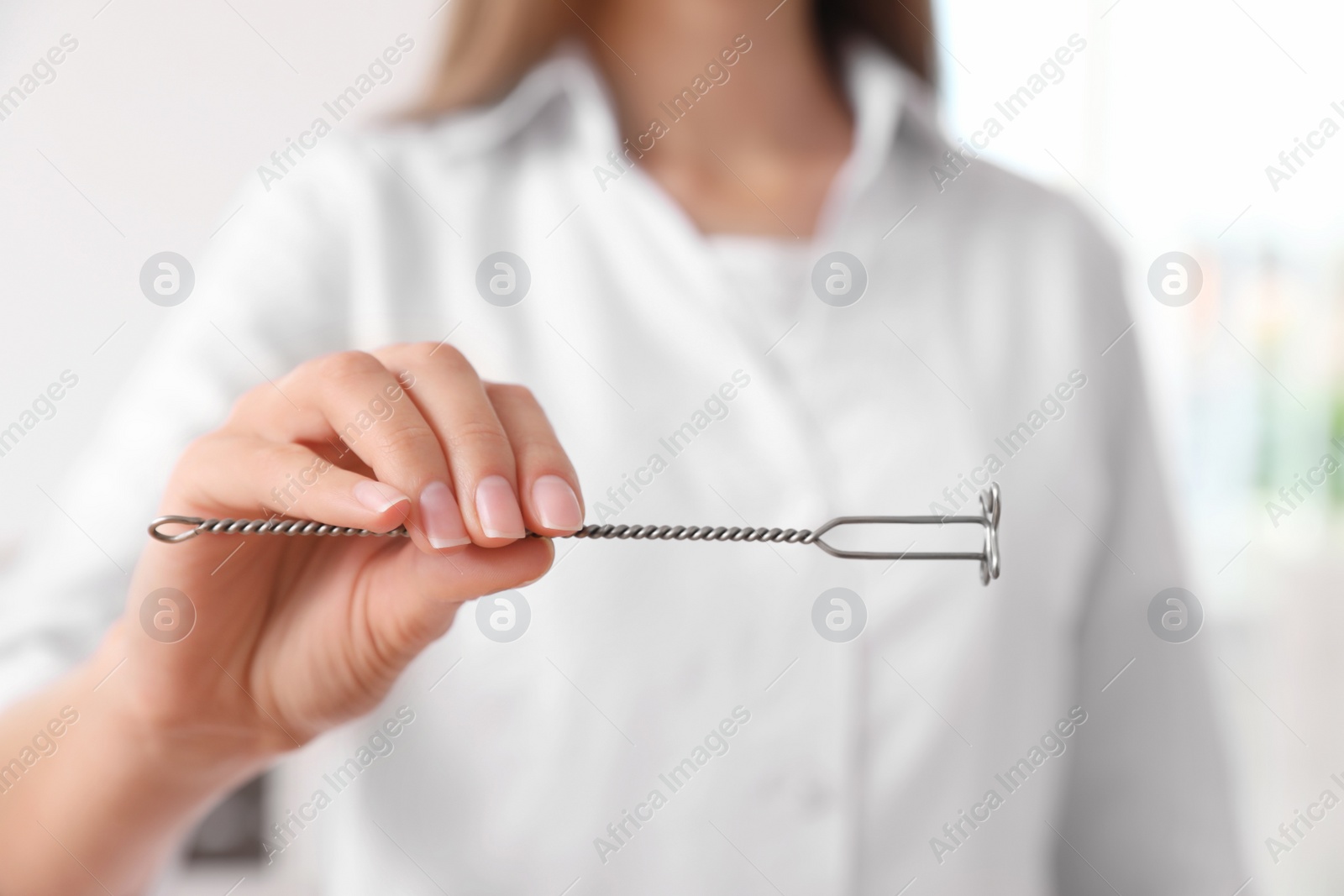 Photo of Speech therapist with logopedic probe in clinic, closeup