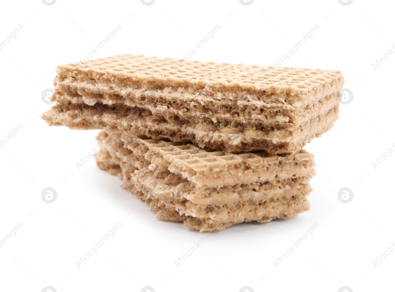 Photo of Delicious broken crispy wafer on white background. Sweet food